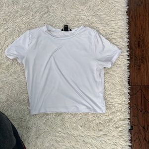 Soft white tee shirt, badly worn
